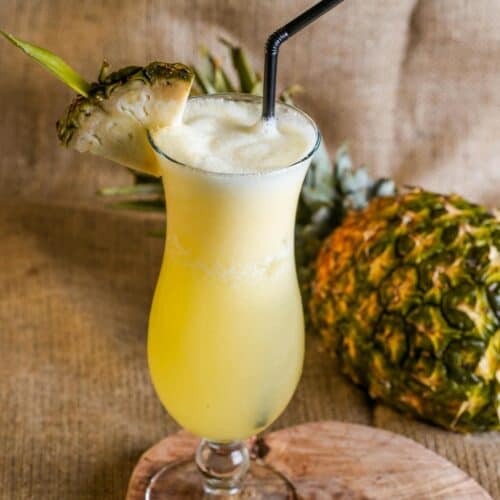 Photo of a virgin pina colada and a pineapple