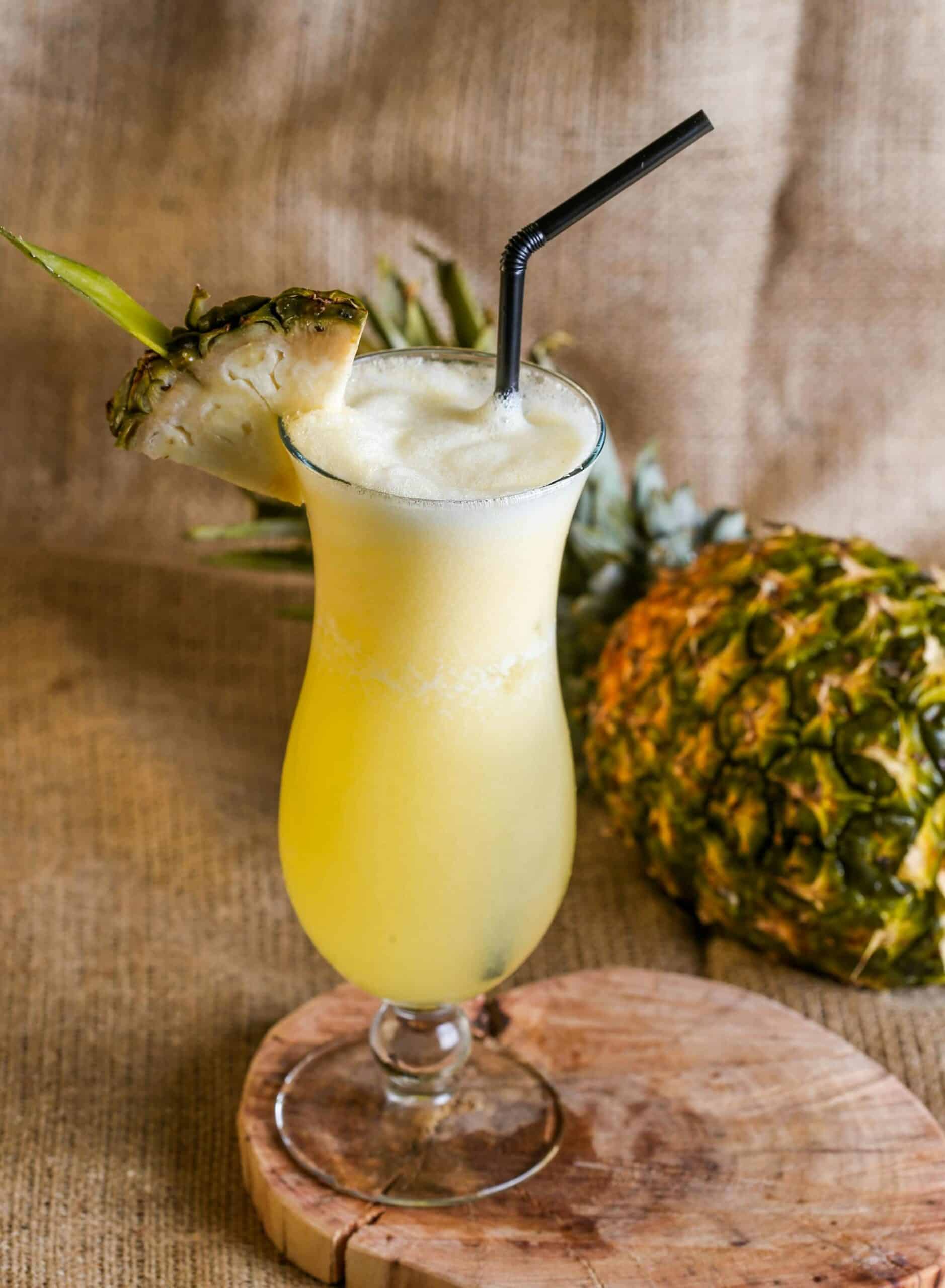 Photo of a virgin pina colada and a pineapple