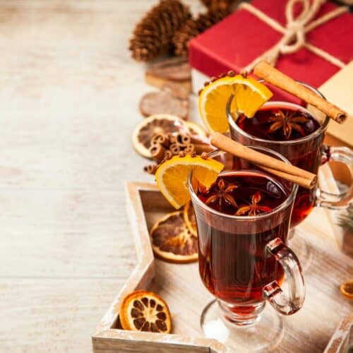 2 glasses of non-alcoholic mulled wine with cinnamon stick