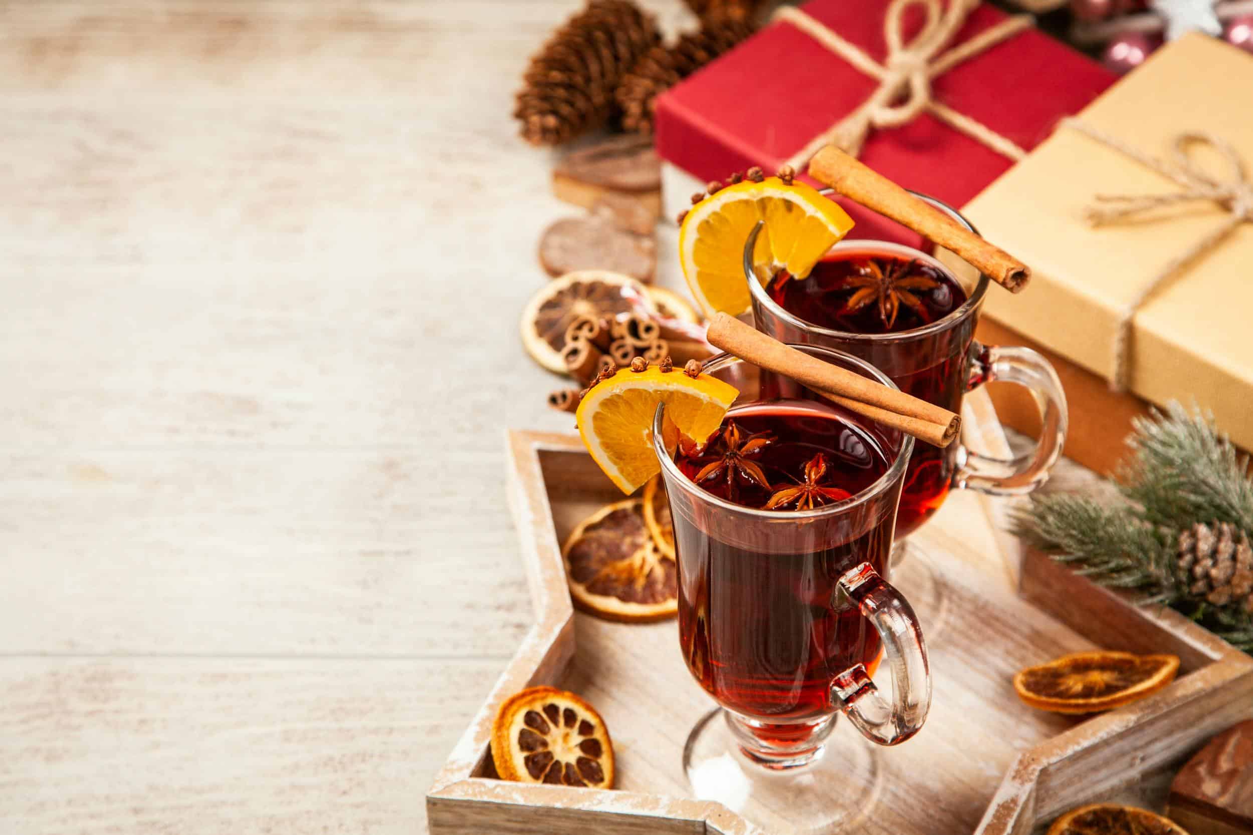 2 glasses of non-alcoholic mulled wine with cinnamon stick