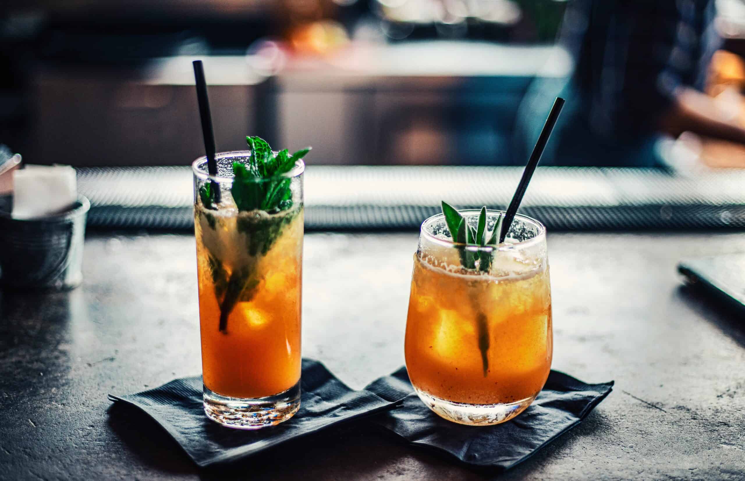 Photo of 2 different sized glasses with cocktails without alcohol